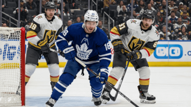 Maple Leafs vs. Vegas Golden Knights game action, featuring players battling for the puck near the net.
