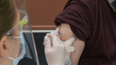 Senior reviewing a medical bill, illustrating the high cost of senior vaccines in B.C.