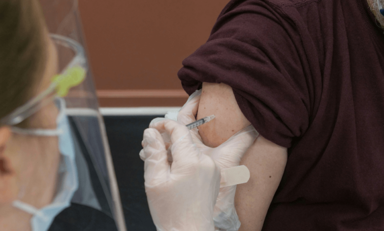 Senior reviewing a medical bill, illustrating the high cost of senior vaccines in B.C.