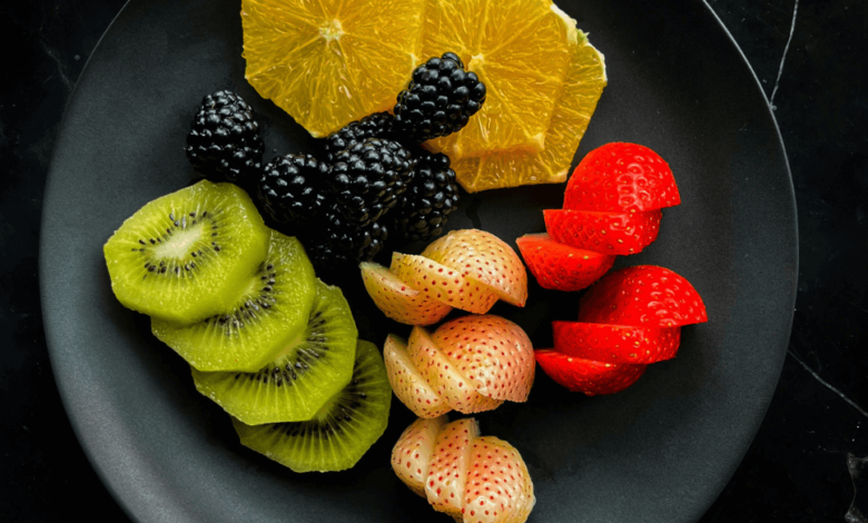 A selection of foods known to lower cholesterol, including oats, avocados, and fatty fish.