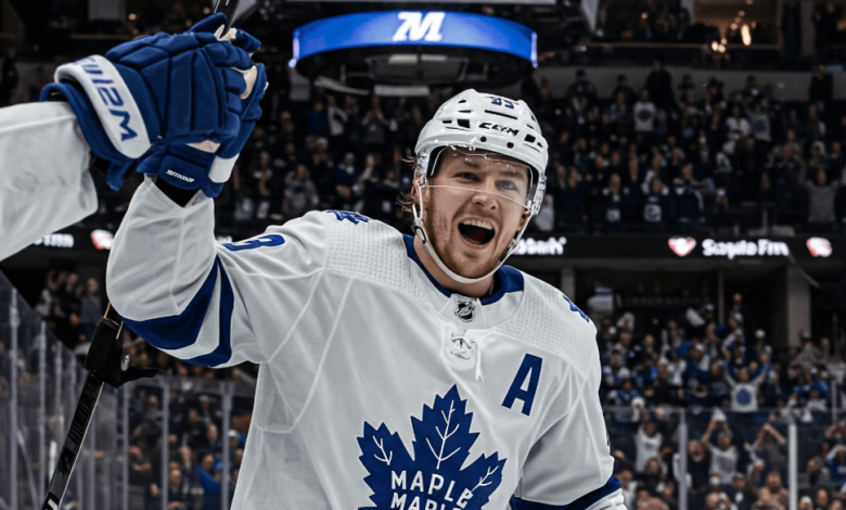 Matthew Knies celebrates after scoring a hat trick and game-winning goal in overtime for the Toronto Maple Leafs