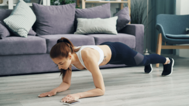Woman performing HIIT workouts at home.