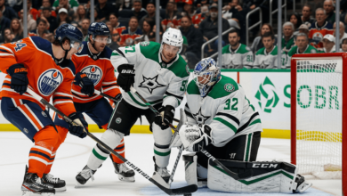 Edmonton Oilers and Dallas Stars players battling on the ice during an NHL game