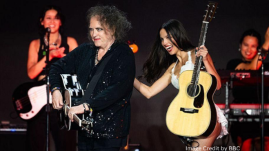 Olivia Rodrigo and Robert Smith singing together on Glastonbury’s Pyramid Stage during her 2025 headline performance