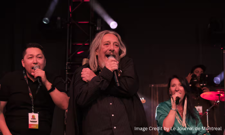 Serge Fiori singing on stage during a live performance, representing his legacy in Québec culture and music.