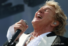 Rod Stewart singing on Pyramid Stage during Glastonbury 2025 Legends Slot performance with Celtic-themed backing singers