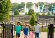 Family entering Granby Zoo with animal exhibits and water park in the background