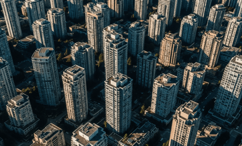 Aerial view of Metro Vancouver skyline showing dense residential buildings, representing rent prices in June 2025