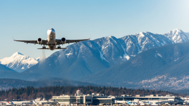 Flight taking off from Vancouver airport with mountains in the background