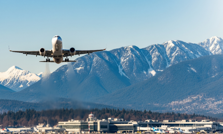 Flight taking off from Vancouver airport with mountains in the background