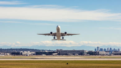 Airplane taking off from Vancouver YVR airport in summer sky, symbolizing cheap domestic flights in June 2025