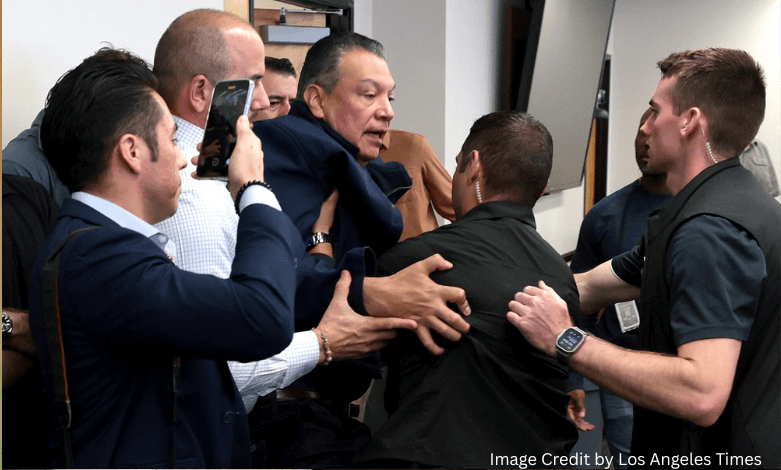 Senator Alex Padilla being handcuffed by federal agents during DHS briefing led by Kristi Noem