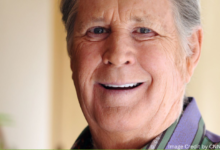 Brian Wilson, co-founder of The Beach Boys, captured in a timeless moment reflecting his musical journey.