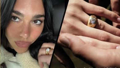 Dua Lipa wearing a chunky gold engagement ring designed by Callum Turner