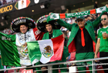 Excited fans cheering during the Mexico vs USA Gold Cup 2025 Final at NRG Stadium in Houston.