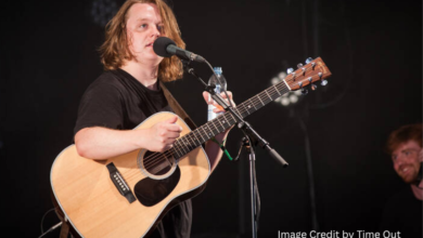Lewis Capaldi singing live on stage, announcing his 2025 Australia tour with dates in Melbourne, Sydney, Brisbane, Adelaide, and Perth