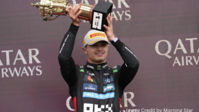 Lando Norris celebrates victory at the 2025 British Grand Prix in Silverstone with a trophy in hand