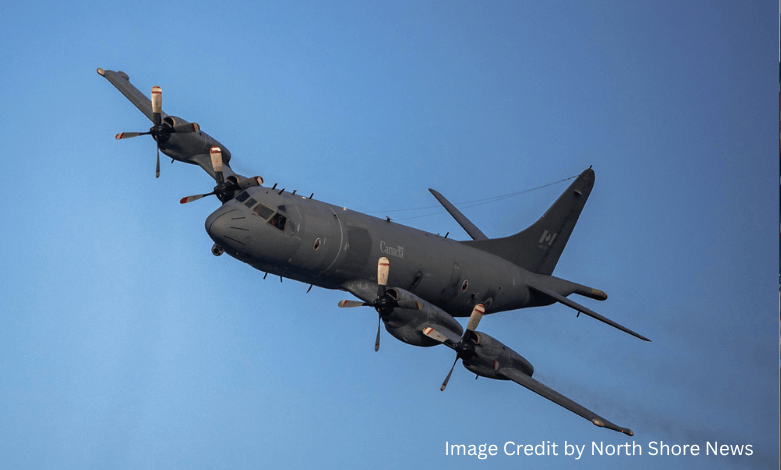 Royal Canadian Air Force CP-140 Aurora flying low over Burrard Dry Dock Pier in North Vancouver