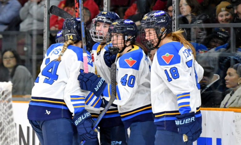 PWHL Vancouver players celebrate during a high-intensity match in front of a packed crowd