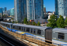 SkyTrain Expansion in Vancouver with trains running through a modern urban skyline