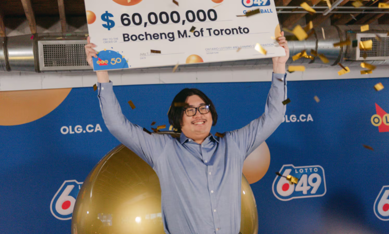 Toronto man wins $60M Lotto Max jackpot, holding a winner’s cheque, celebrating at lottery event.