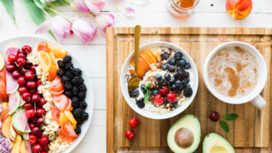 Top view of healthy ingredients and a notebook used for weekly meal planning