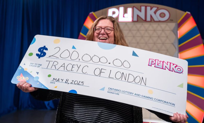 Canada Day Lotto Max Win celebration as Ontario woman holds $200,000 Plinko prize cheque