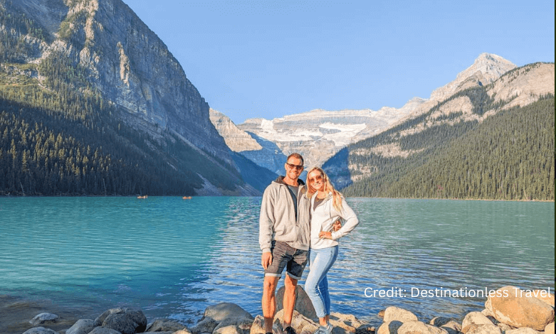 Couple overlooking Lake Louise on a budget-friendly Canadian road trip