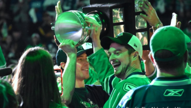 Abbotsford Canucks players celebrating Calder Cup win with fans and confetti inside Abbotsford Centre