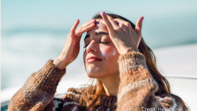 Close-up of woman applying moisturizer to protect skin in harsh Canadian winter