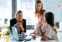 Diverse group of BC-based female tech entrepreneurs working together in a modern co-working space