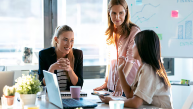 Diverse group of BC-based female tech entrepreneurs working together in a modern co-working space