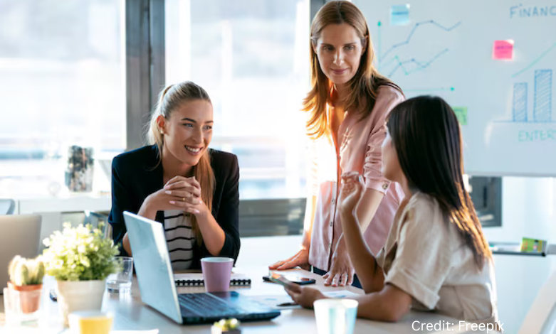Diverse group of BC-based female tech entrepreneurs working together in a modern co-working space