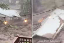 A house being carried away by floodwaters in Ruidoso, New Mexico during the July 2025 flash flood