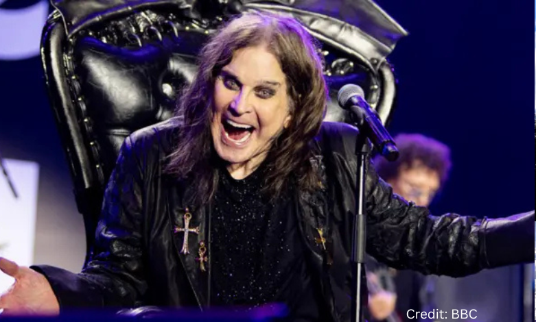 Ozzy Osbourne on stage during his final concert in Birmingham, seated and singing under a spotlight, July 2025.