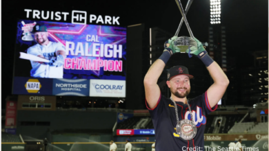 Cal Raleigh celebrates after winning the 2025 Home Run Derby, making history as the first catcher to claim the title