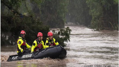 Emergency responders evacuating residents during New York flooding 2025