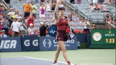 Eugenie Bouchard smiling and waving to fans at the National Bank Open in Montreal during her retirement match