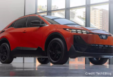 Sleek 2026 Subaru Uncharted EV electric crossover parked in an urban landscape with modern architecture