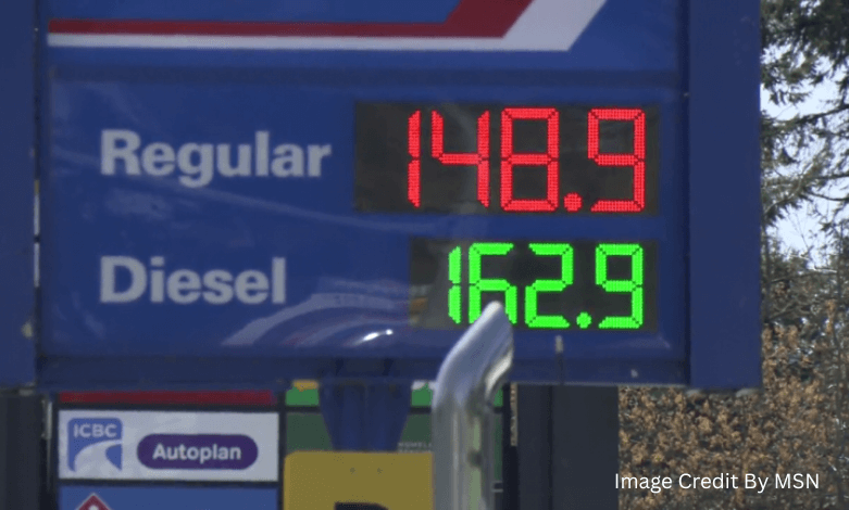 Digital gas station price board in British Columbia showing current pump prices for regular and premium fuel