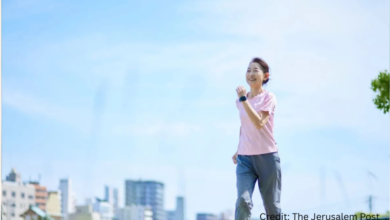 Woman doing Japanese walking routine in park for daily 30-minute weight loss and low-impact fitness