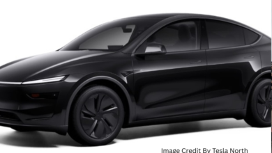 Tesla Model Y in Diamond Black color parked in an urban Canadian setting, showcasing the latest design