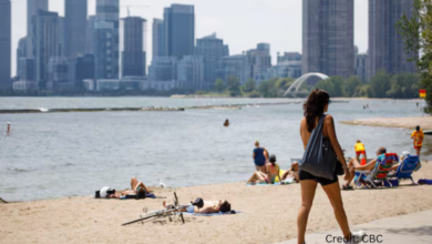 “Toronto skyline under heavy summer heat haze during a Canadian heat wave”