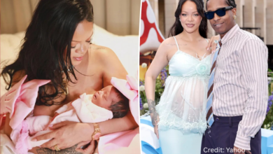 Rihanna cradling newborn daughter Rocki in a soft pink wrap during the public birth reveal