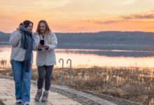 Two women enjoying a sunset waterfront walk during Vancouver’s Sunset Walk & Chill Events