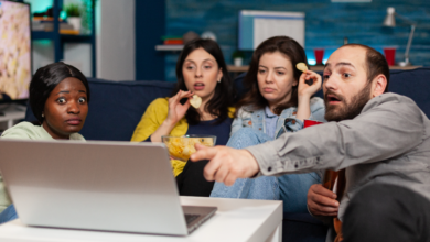 Friends watching top trending Netflix & OTT shows in Canada right now on a laptop while reacting to a dramatic scene