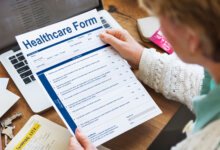Person reviewing a healthcare form for therapy cost and insurance coverage