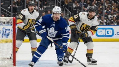 Maple Leafs vs. Vegas Golden Knights game action, featuring players battling for the puck near the net.