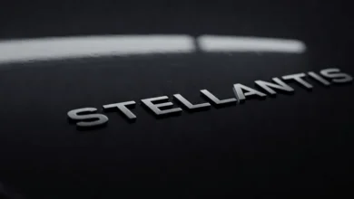 Stellantis logo on a dark vehicle surface, representing the Stellantis tariff impact on Jeep and Ram.