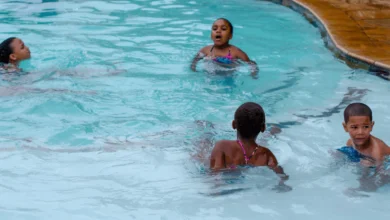 Children enjoying a sunny day at one of Surrey’s outdoor pools during free swim season